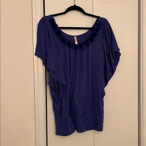 Blue short sleeve blouse with flower detail